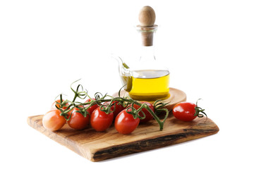 Bottle of olive oil and tomatoes