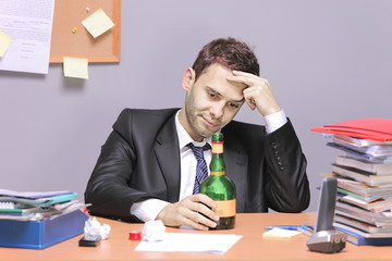 A drunk businessman in the office