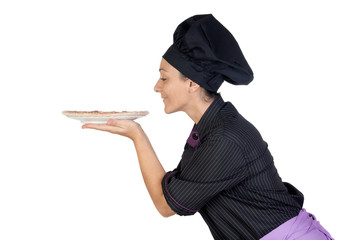 Pretty cook woman smelling ham pizza