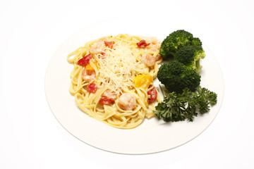 Shrimp scampi with linguine and a side of broccoli.