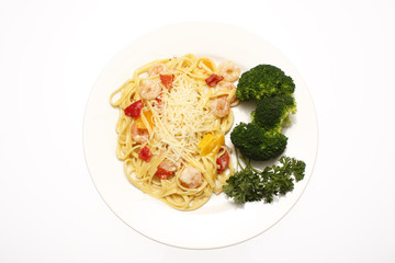 Shrimp scampi with linguine and a side of broccoli.