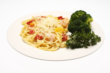 Shrimp scampi with linguine and a side of broccoli.