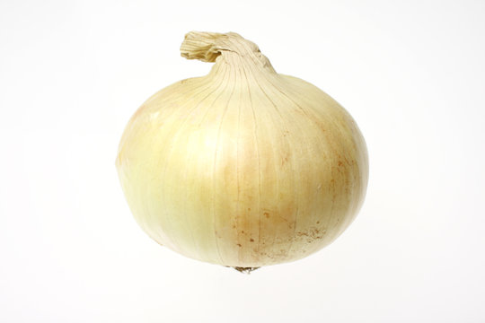 Yellow onion isolated on white.
