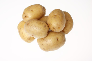 Yellow potatoes isolated on white.