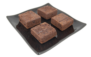 chocolate brownies on plate isolated on white background