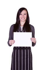 Beautiful Girl in the Kitchen Holding a Blank Sign