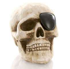 Obraz premium human skull with eye patch on white background