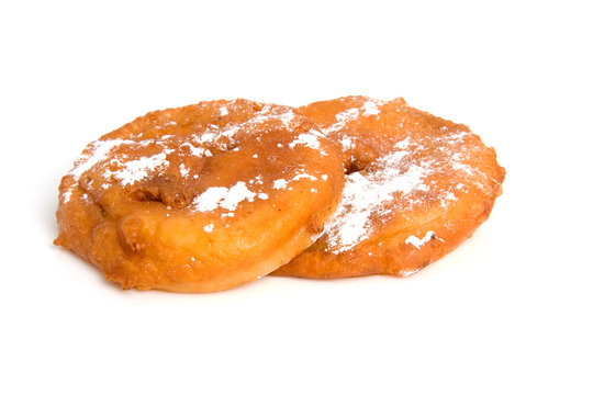 two home bakes apple fritter over white background
