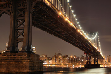 New York City Skyline and Manhattan Bridge At Night - 19263539