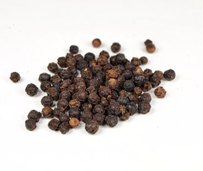 Juniper spices seeds on white background.