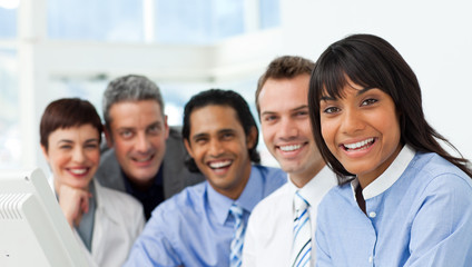A business group showing diversity smiling at the camera