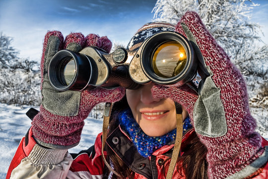 woman hiker with binoculars