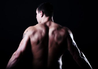 Fototapeta na wymiar Back of muscular guy