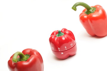 Red peppers and red alarm clock