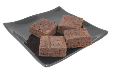 fresh brownies on plate isolated on white background
