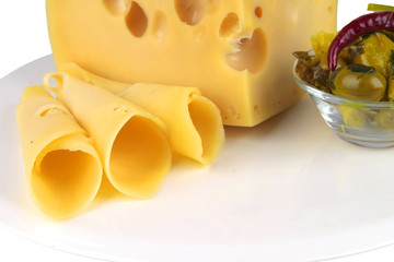 big yellow cheese chunk and slices with olives