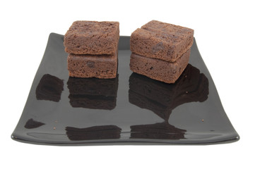 chocolate brownie cakes on plate on white background