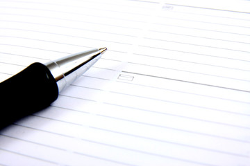 business pocket planner and pen ready to note an appointment