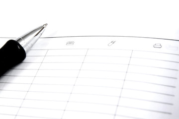 business pocket planner and pen ready to note an appointment