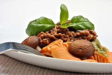 home made pasta with mince sauce and basil