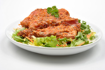 some marinated organic rib on healthy salad