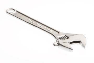 An adjustable crescent wrench isolated on white