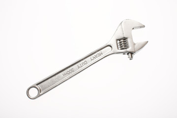 An adjustable crescent wrench isolated on white