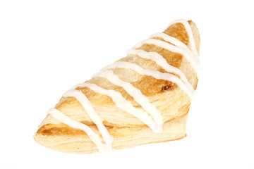 A turnover pastry with icing.