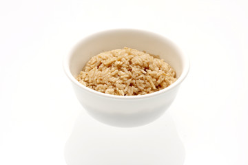 Bowl of rice on a table.