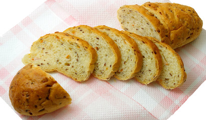 Grain bread -  cut long loaf on a paper napkin