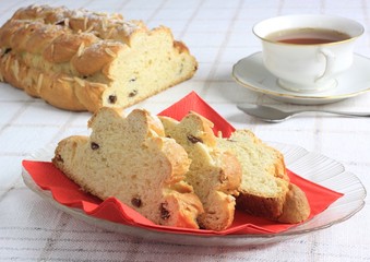 A cup of tea and cake with almond