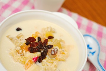 Healthy fruit salad topped with raisins