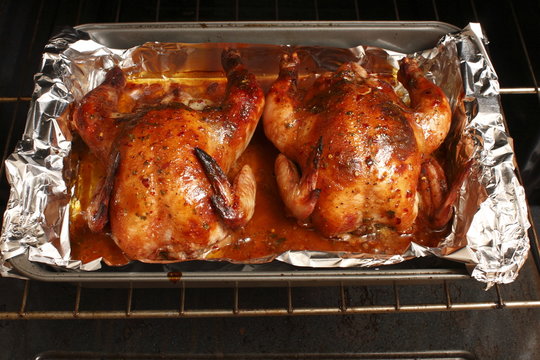 Baked Cornish game hens fresh out of the oven.