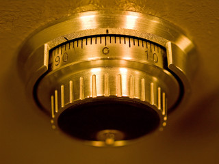 Closeup of a Safe Vault Combination Spinner - Gold Toned