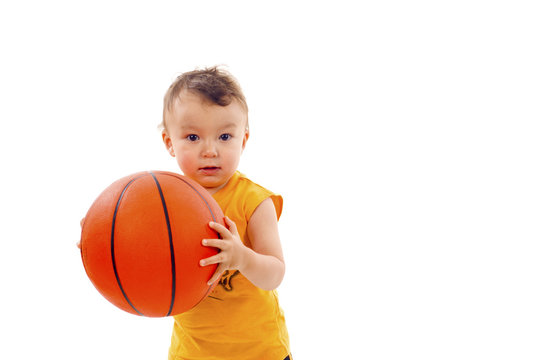 Adorable Baby Boy Playing with a Basketball - Isolated