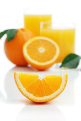 Orange with orange juice and the cut slices