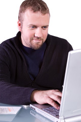 Young Casual Businessman Working at his Desk