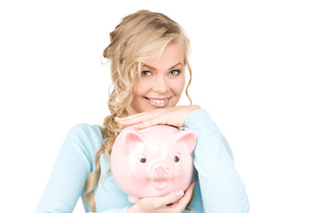 lovely woman with piggy bank