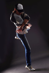 Fototapeta premium cool man dancer against black background