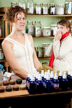 Woman with a cold shops for a cure
