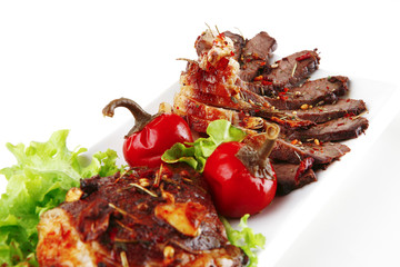 served meat on ceramic plate