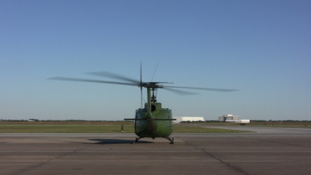 Military helicopter with running engine