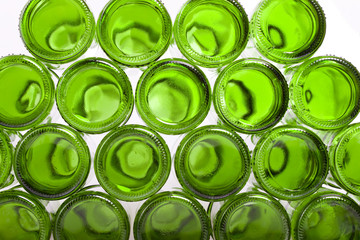 Bottoms of empty glass bottles on white background