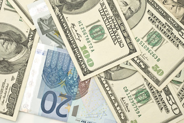 Fototapeta na wymiar Euro and US dollar banknotes