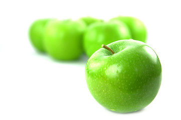 Green apples on white background