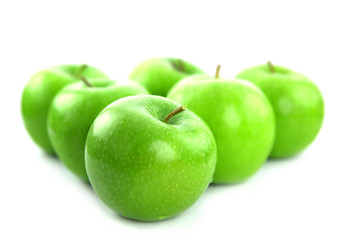 Green apples on white background