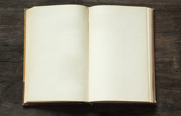 blank open book on wooden background