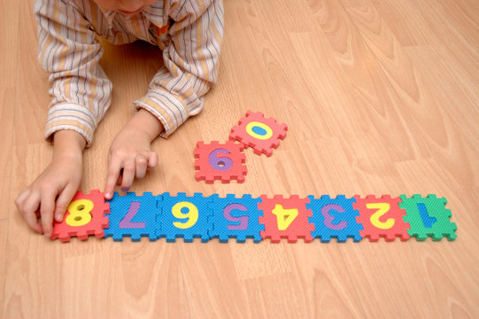 child  playing with numbers