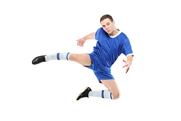 Fototapeta premium Footballer in a jump isolated on white background