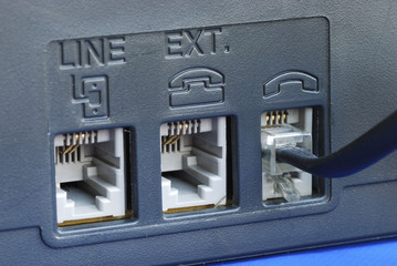Line connectors at the back of a fax machine